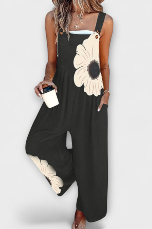Clémentine - Schwarze Latzhose mit großen Blumenmotiven